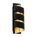 Moderne Wandleuchte mit schwarzem, spiralförmigem Metall und goldener Innenseite, elegantes Design.