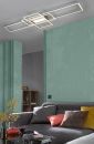 Moderne LED-Deckenleuchte im Wohnzimmer mit grauem Sofa, bunten Kissen und mintgrüner Wand.
