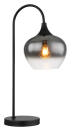 Moderne Tischlampe mit schwarzem Gestell und rauchgrauem Glas, leuchtende Glühbirne sichtbar.